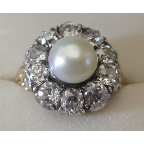 661 - An Old Cut Diamond and Pearl Cluster Ring in a high carat precious yellow metal setting, EDW 2.4ct, ... 