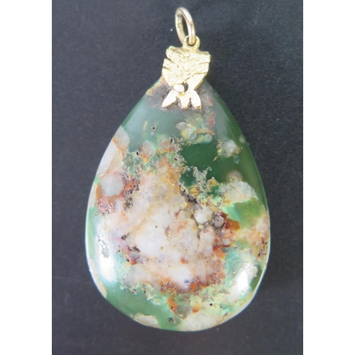 670 - A Jade Tear Drop Pendant with yellow metal mount, 52mm drop