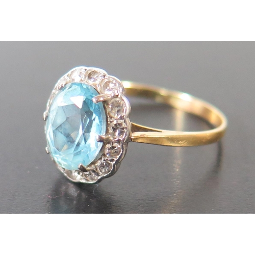 676 - An Aquamarine and Diamond Cluster Ring, aquamarine  9x7mm, size N, 2.2g