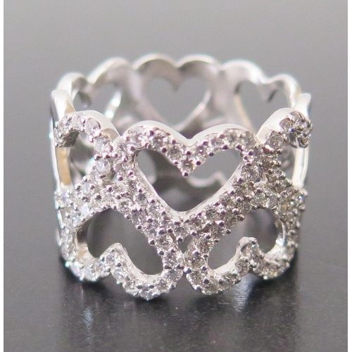 679 - An 18ct White Gold and Diamond Heart Ring, size S.5 to centre of 15mm wide ring, 9.8g