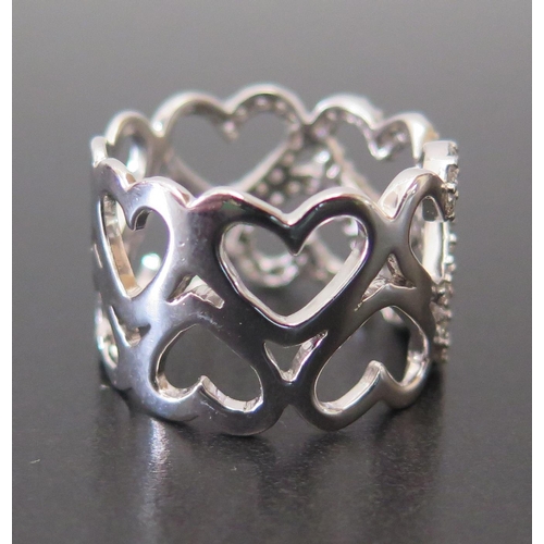 679 - An 18ct White Gold and Diamond Heart Ring, size S.5 to centre of 15mm wide ring, 9.8g