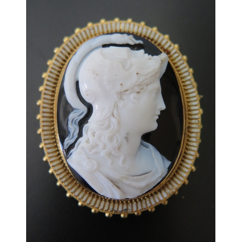 687 - An Early Nineteenth Century Twin Head Hardstone Cameo Brooch decorated with female bust and male fac... 