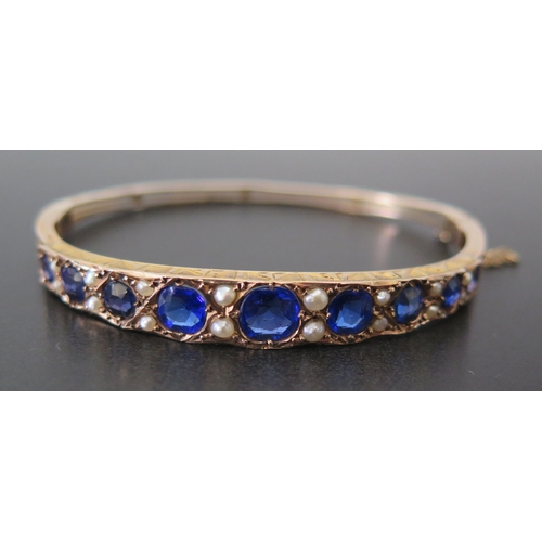 688 - An Edwardian 9ct Gold, Sapphire and Pearl Hinged Bangle, Birmingham 1902, NB, 8.8g, in a contemporar... 