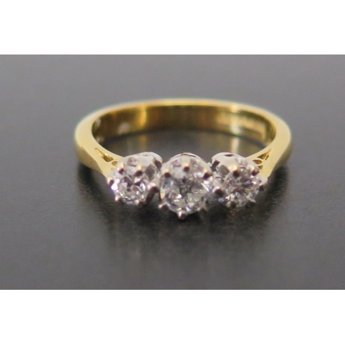 690 - An 18ct Yellow Gold Three Stone Diamond Ring, size J.5, 3.3g