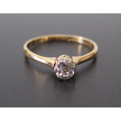 692 - A Diamond Solitaire in a high carat gold setting, marks rubbed, P.5, 2g