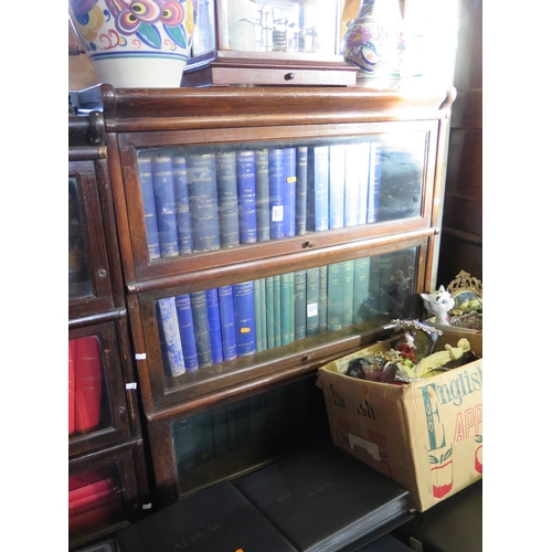 385 - An Oak Globe Wernicke Four Tier Bookcase