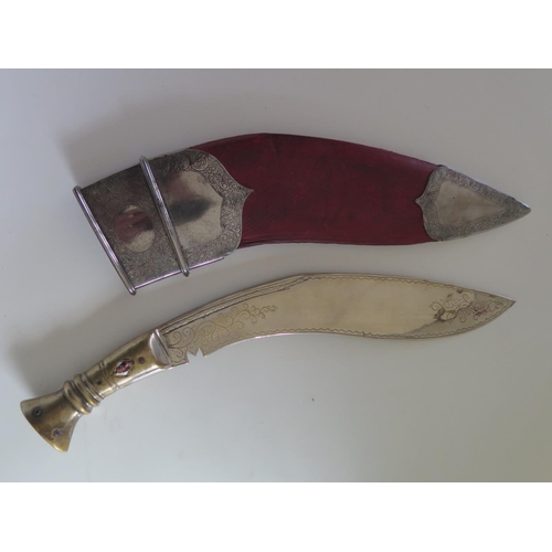 125 - A Modern Kukri, scabbard with white metal mounts, 36cm overall length