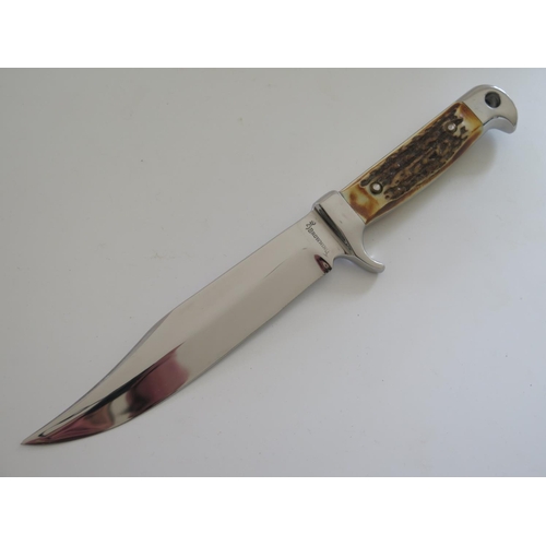 149 - A Browning Bowie Knife with semi serrated blade and antler handle, 28cm overall length
