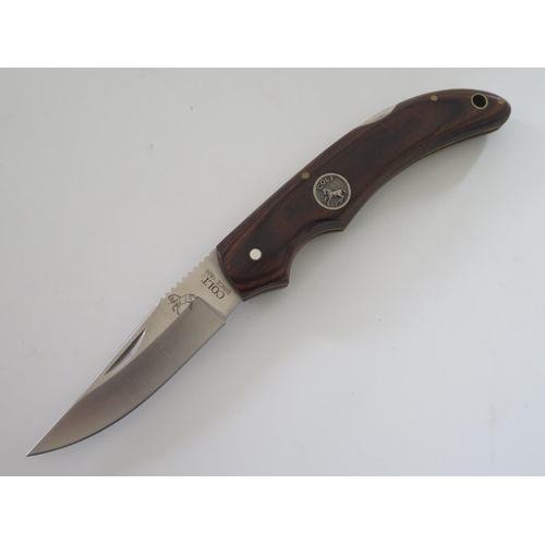 237 - A Colt Folding Pocket Knife with leather sheath CT233