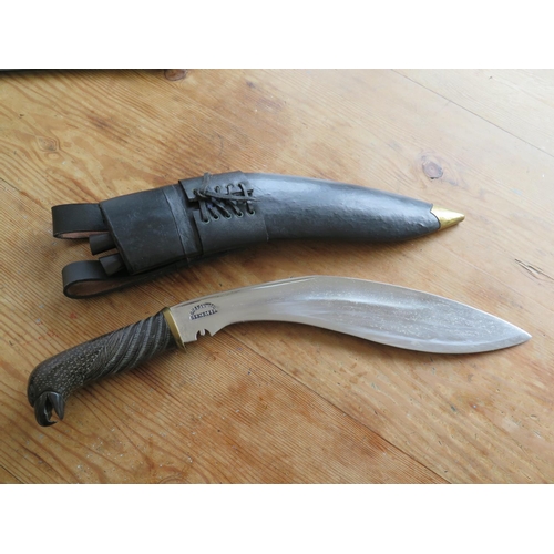 309 - A Modern Kukri with bird of prey pommel, 17