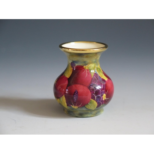 115 - A Modern Moorcroft Enamel Pomegranate Vase, 5cm, dated 98 and initialled JH, boxed