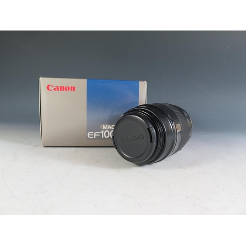 303 - A Canon MACRO EF100mm f/2.8 Lense. Appears in excellent condition