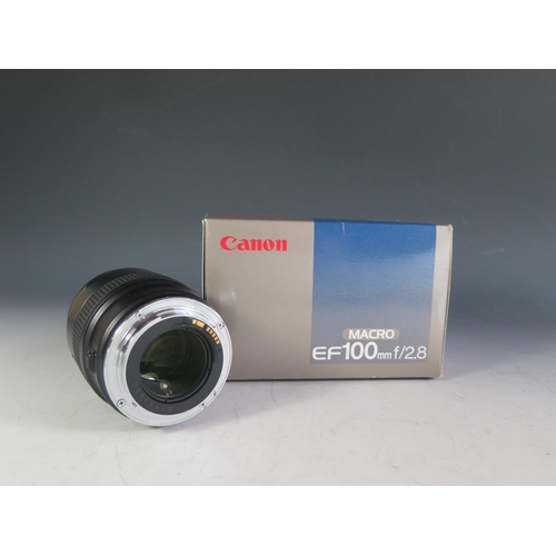 303 - A Canon MACRO EF100mm f/2.8 Lense. Appears in excellent condition