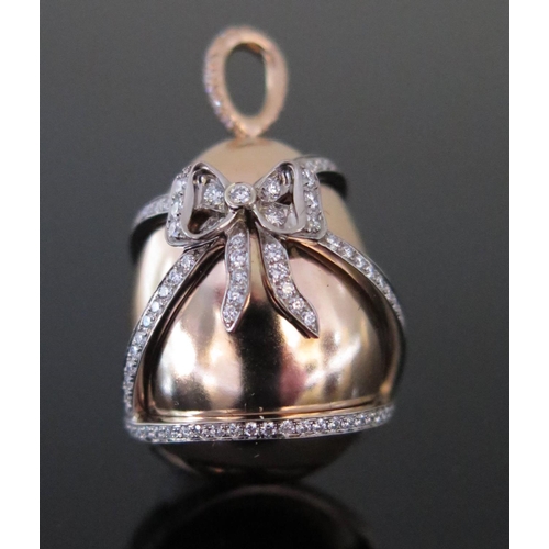 585 - An 18ct Rose Gold and Diamond Ribbon Inlaid Egg Pendant, 3cm long, 14.3g