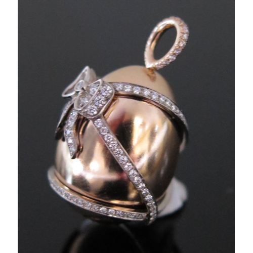 585 - An 18ct Rose Gold and Diamond Ribbon Inlaid Egg Pendant, 3cm long, 14.3g