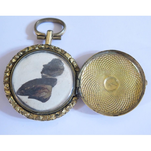 593 - A Georgian Memorial Locket decorated with half length silhouette of a gentleman, 34mm diam.