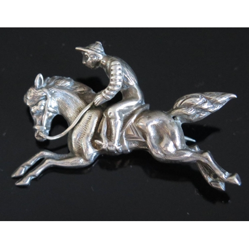 602 - A Victorian Silver Horse and Jockey Brooch, back stamped Rd. 15839, 43mm wide, 5.4g