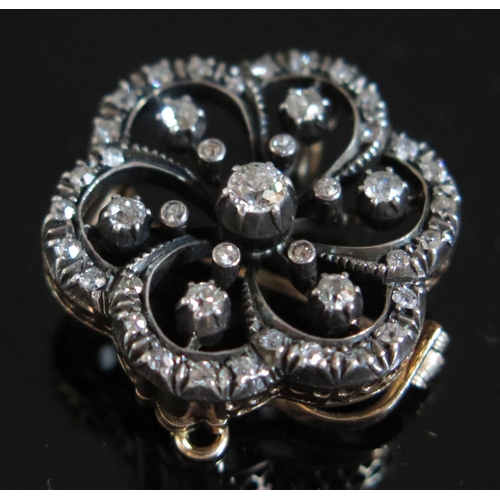 609 - A Victorian Diamond Pendant Brooch, central diamond estimated .17ct, 25mm diam., 7.7g