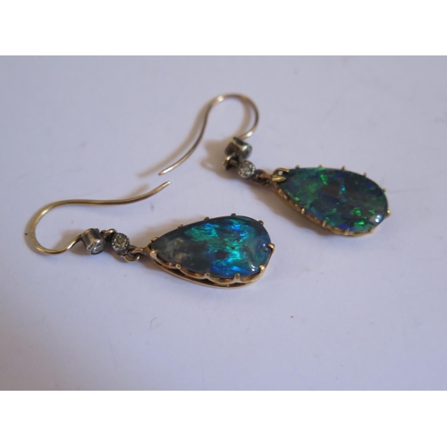 611 - A Pair of Victorian Black Opal and Diamond Pendant Earrings, c. 35mm drop, opal 16x9mm, 2.7g
PRICE A... 