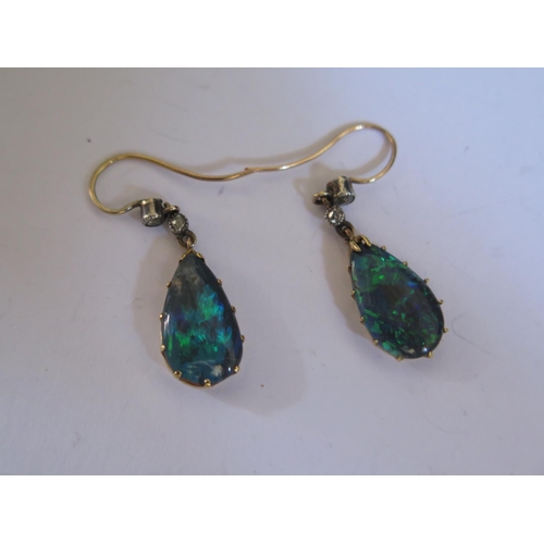 611 - A Pair of Victorian Black Opal and Diamond Pendant Earrings, c. 35mm drop, opal 16x9mm, 2.7g
PRICE A... 