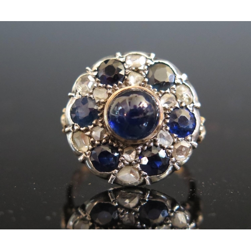 614 - An Antique Cabochon and Round Cut Sapphire and Rose Cut Diamond Dress Ring in a foliate high carat g... 