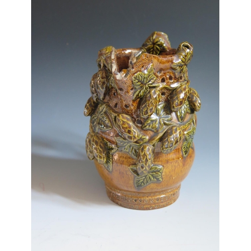 62 - A Mid 19th Century Sussex Rye Pottery Puzzle Jug with treacle glaze and green glazed applied hop and... 