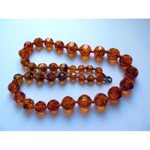 620 - A Graduated Faceted Faux Orange Amber Bead Necklace, 67cm, 83.7g