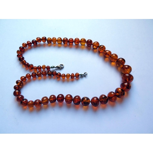 622 - A Graduated Orange Amber Bead Necklace with inclusions, 52cm, 30g