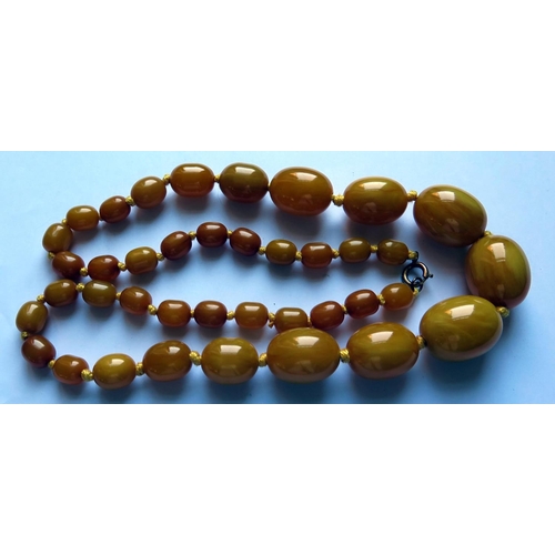 627 - A Graduated Faux 'Baltic' Amber Bead Necklace, 69cm, 88.8g