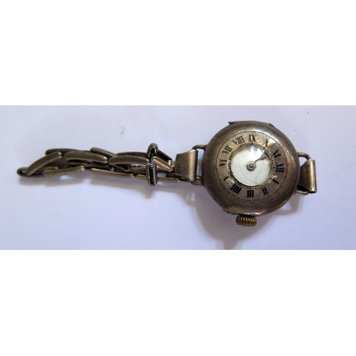 642 - A Ladies Silver Trench Watch, running but glass, dial and hands damaged