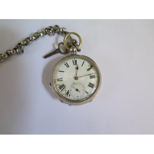 643 - A .800 Silver Open Dial Pocket Watch (running but badly damaged) on a silver Albert with two silver ... 