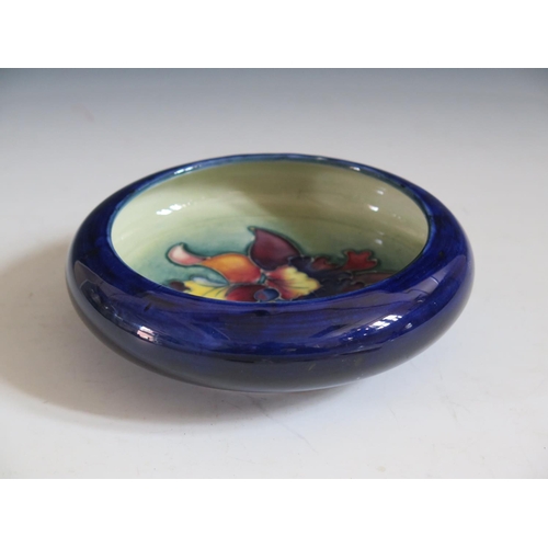 73 - A Morcroft Hibiccus Pattern Blue Cupped Bowl, 16cm diam.