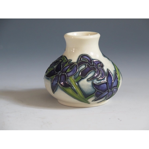 85 - A Modern Moorcroft Periwinkle Pattern Squat Vase, base marked 2014, 6cm, boxed