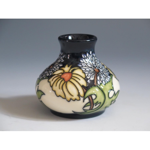 89 - A Modern Moorcroft Daisy May Pattern Squat Vase, base marked 2008, 6cm, boxed