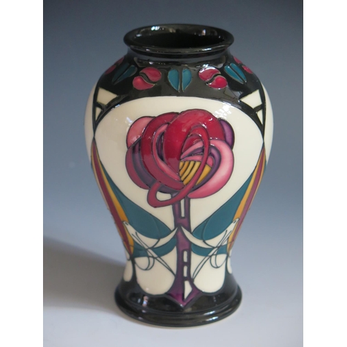 92 - A Modern Moorcroft Stylised Bird and Flower Vase by Sian Leeper, base marked 2006, 16cm, boxed