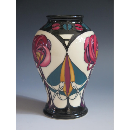 92 - A Modern Moorcroft Stylised Bird and Flower Vase by Sian Leeper, base marked 2006, 16cm, boxed