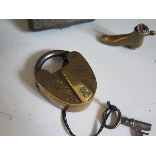 269 - A Bryant & May Wax Vestas Tin decorated with a stage coach, Victorian brass padlock, cigar cutter in... 