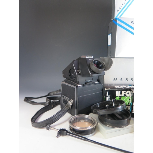 296 - A Hasselblad 500c/m Camera Body (boxed) with film cartridges, 40670 lense shade, 40711 Step-up ring,... 