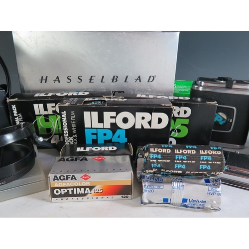 296 - A Hasselblad 500c/m Camera Body (boxed) with film cartridges, 40670 lense shade, 40711 Step-up ring,... 