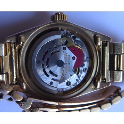 647B - A Ladies Rolex Oyster 18ct Gold Datejust Wristwatch with maroon diamond set dial, 2030 movement no. ... 