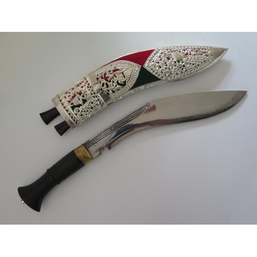 702 - A Modern Kukri with white metal mounted scabbard, 40cm overall length and one other