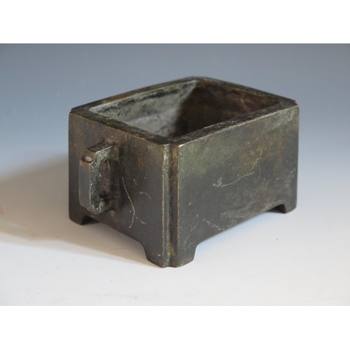 648 - A Chinese Bronze Censer with lug handles, four character mark to base, 15(w)x9(d)x6.7(h)cm. Re-enter... 