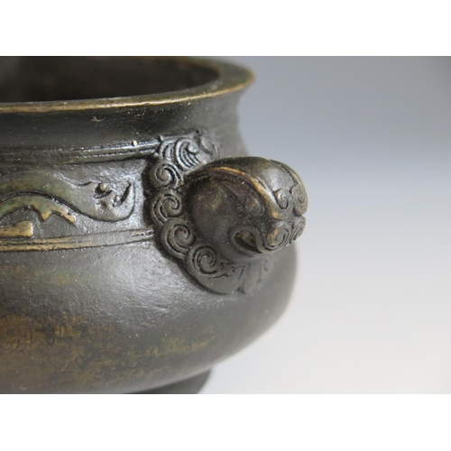 649 - A Chinese Bronze Censer with bird and bat border and mask handles, four character mark to base, 14.5... 