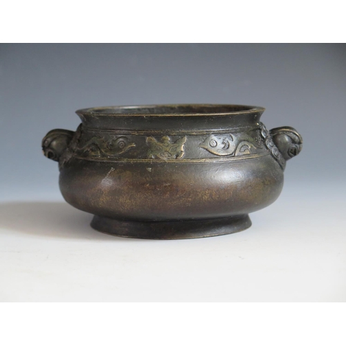 649 - A Chinese Bronze Censer with bird and bat border and mask handles, four character mark to base, 14.5... 