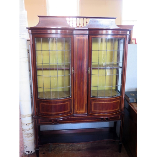 687 - An Edwardian Mahogany and Inlaid Display Cabinet by Henry Barker of Nottingham with twin bow fronted... 