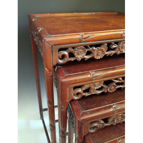 688 - A Chinese Rosewood Nest of Three Tables with carved and pierced foliate apron and stylised bamboo le... 