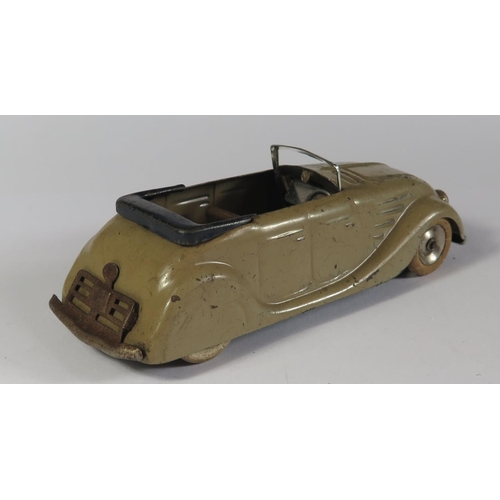 10 - A Triang Minic 14M Streamlined Sports Tourer (Chrysler Airflow) in grey with black base. Motor works... 