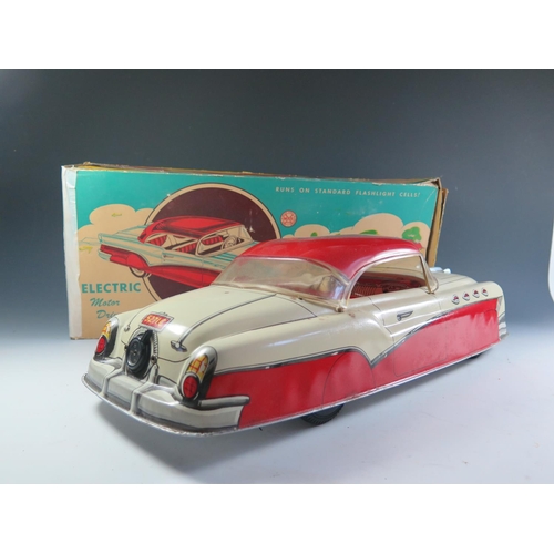 106 - A Very Large Scale Marx Battery Operated Electric Tinplate Convertible Car in Red and Cream in origi... 