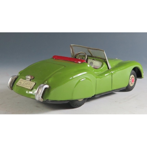 113A - An 1950's Alps Tinplate Jaguar XK 120 in Green with working push n' go motor Made in Japan (16cm app... 