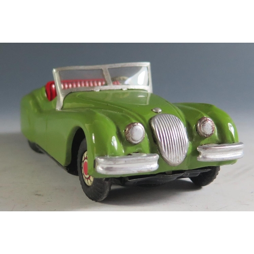 113A - An 1950's Alps Tinplate Jaguar XK 120 in Green with working push n' go motor Made in Japan (16cm app... 